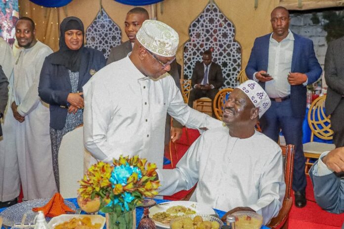 Senate Speaker Amason Kingi and Raila Odinga share a moment during the Iftar dinner in Nairobi hosted by the former Prime Minister. on March 19, 2025.